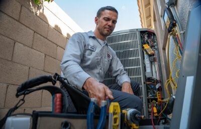 Hydes Nate Certified Technician Fixing Heat Pump